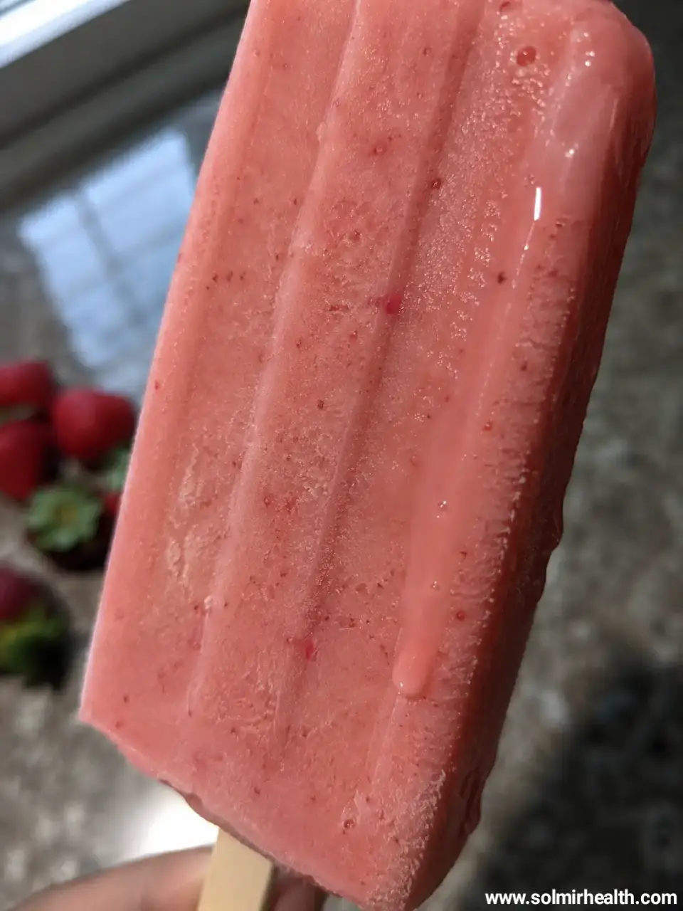 strawberry coconut popsicle close up