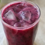 Deep purple blueberry pomegranate juice in a glass
