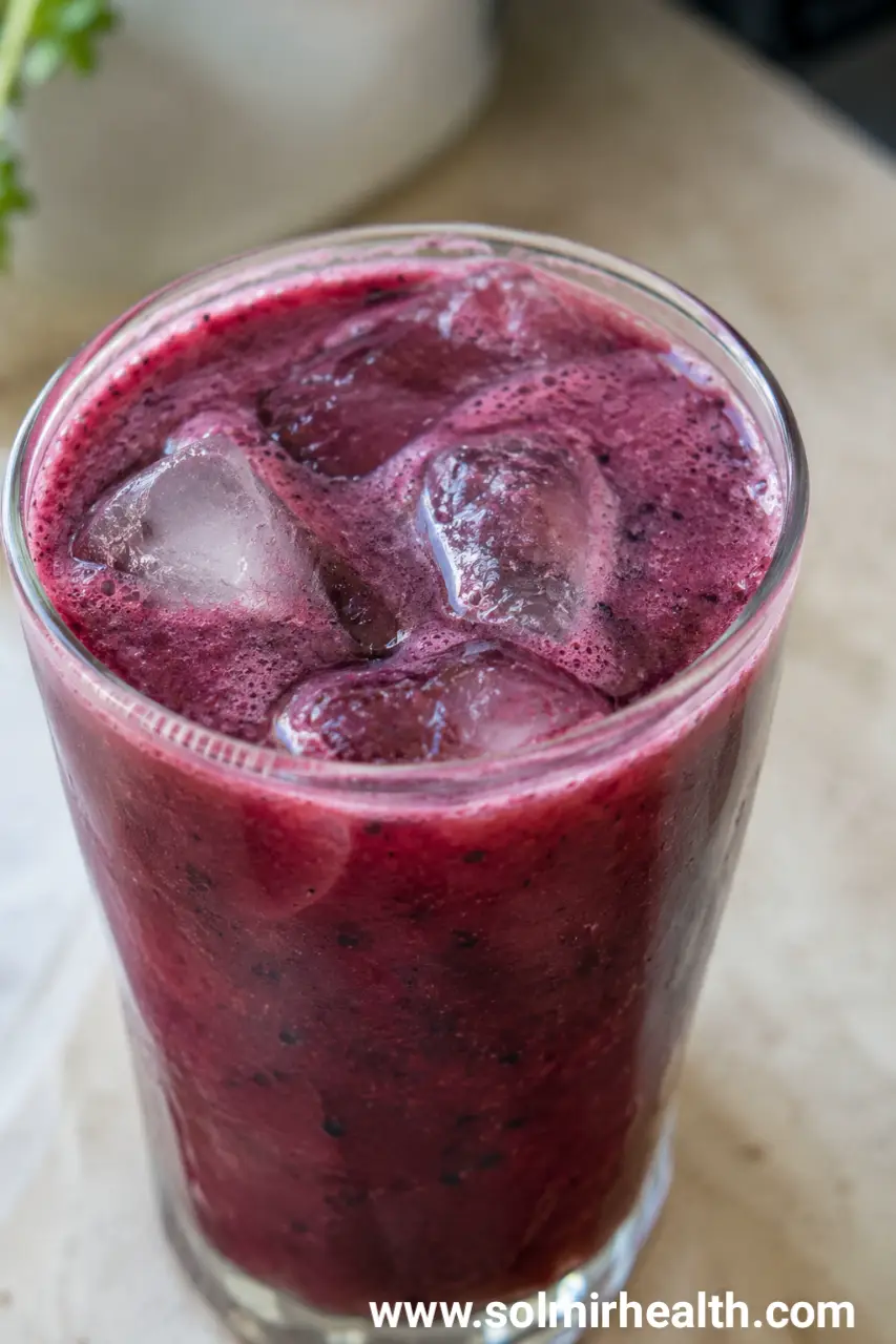Deep purple blueberry pomegranate juice in a glass