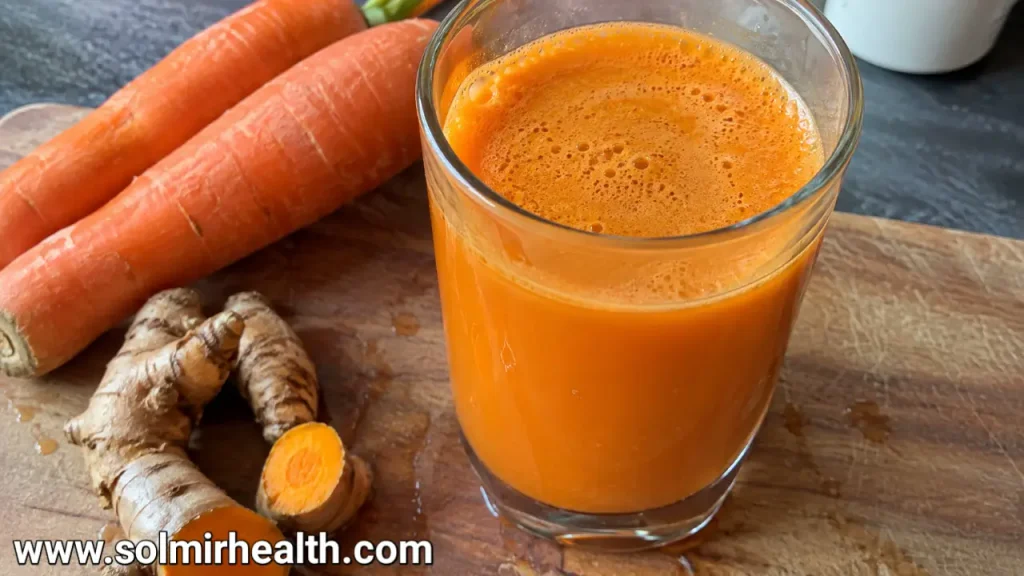 Fresh carrot orange turmeric juice packed with nutrients
