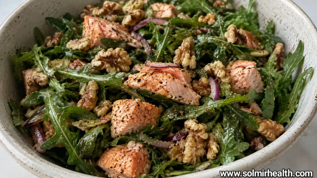 Flaked salmon over arugula with toasted walnuts and Parmesan