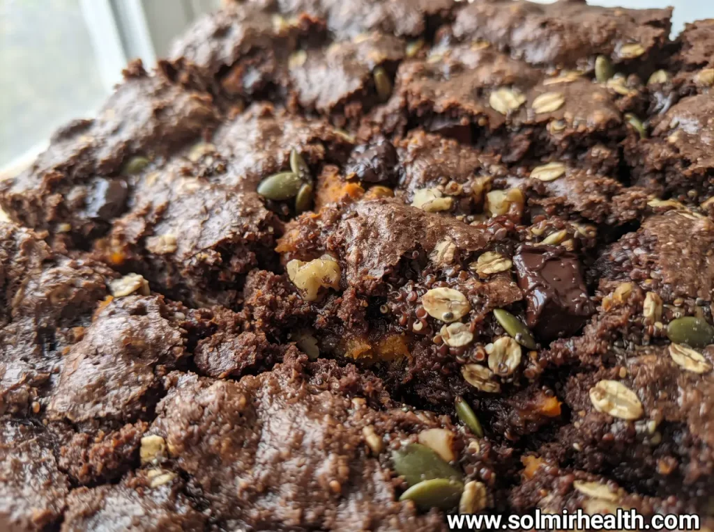 Fudgy sweet potato brownies topped with dark chocolate chips and cut into squares